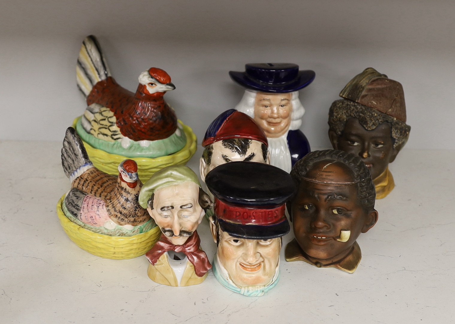 Two 19th century Staffordshire hen egg baskets and covers and a group of 19th/20th century novelty character pots